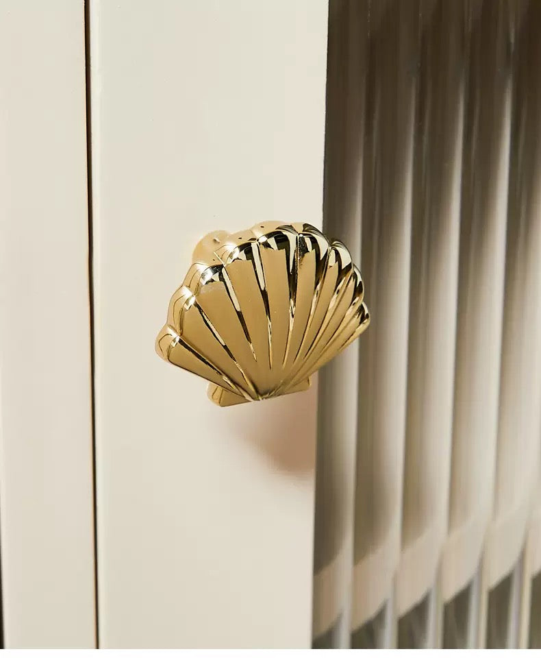 Polished brass scallop shell drawer knob for modern interiors