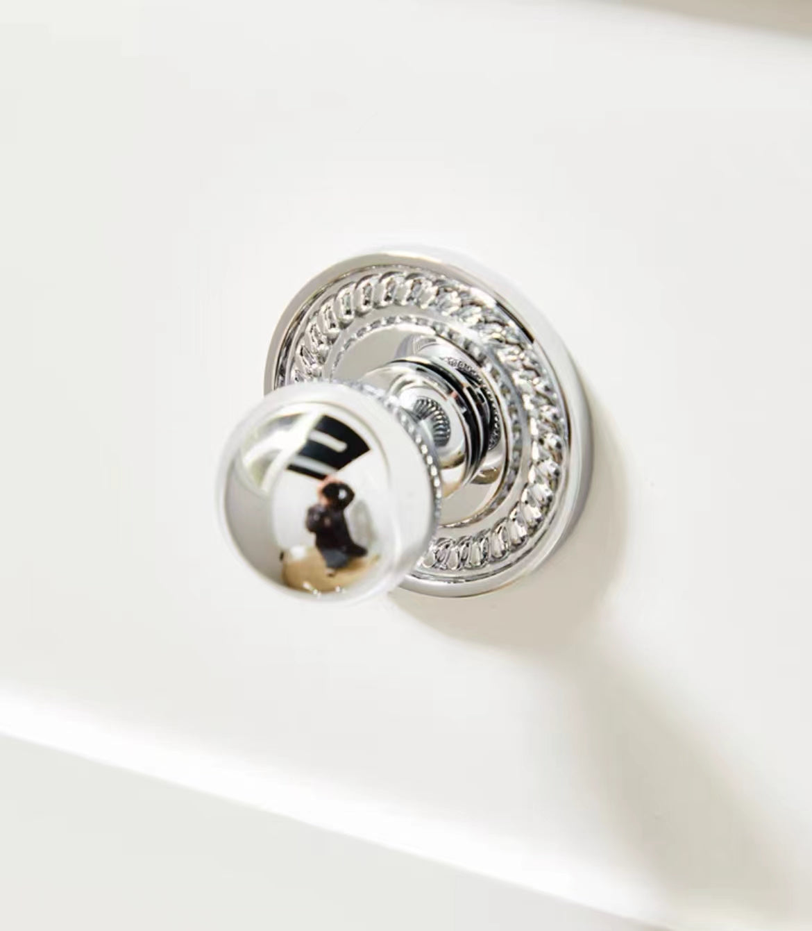 Chrome door knob with decorative round rosette
