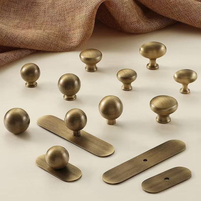brushed aged bronze round cabinet knobs with oval backplates