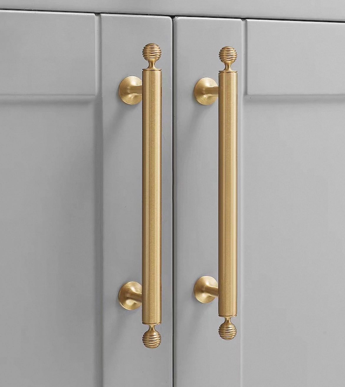 Gold Brass cabinet Bar handles on a gray cabinet