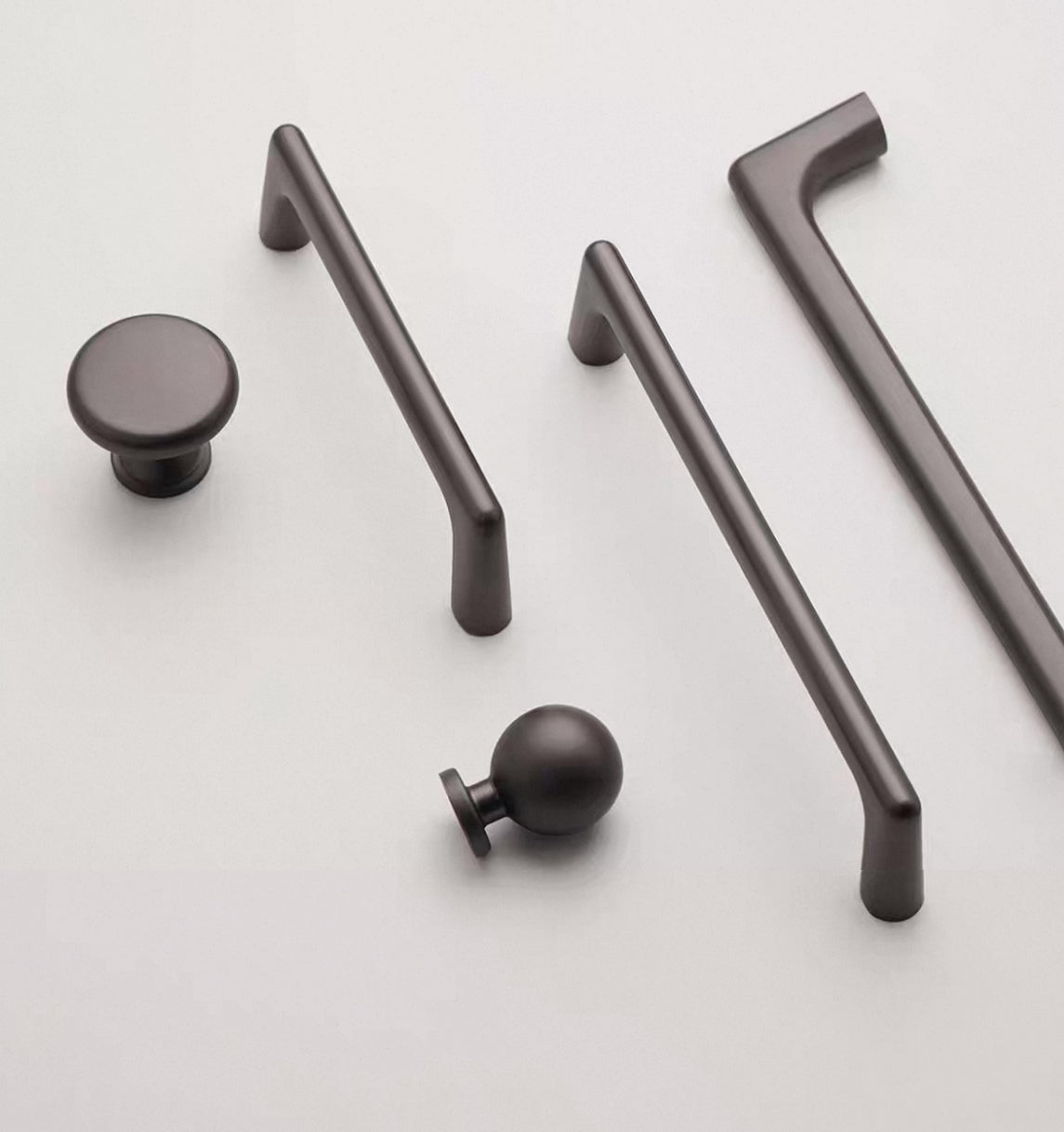 Gunmetal gray d-bar pulls with matching ball knob and disc knob