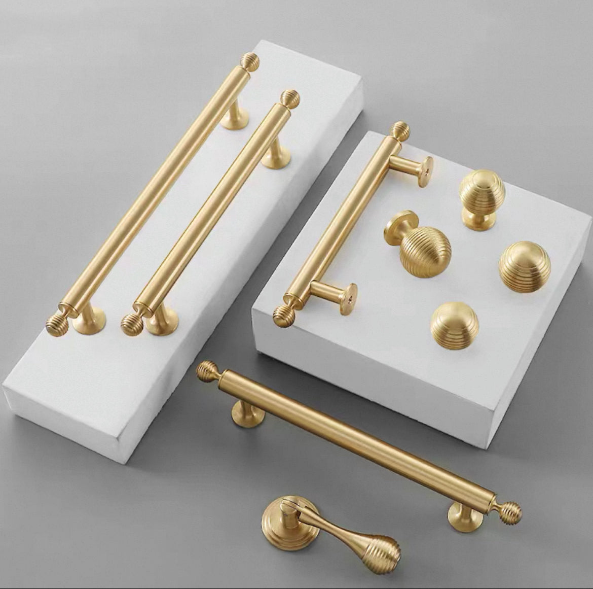 Gold cabinet bar handles, globed knobs and pendant teardrop pull