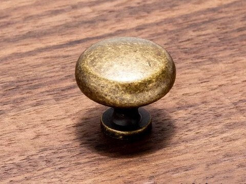 distressed, worn antique bronze round knob