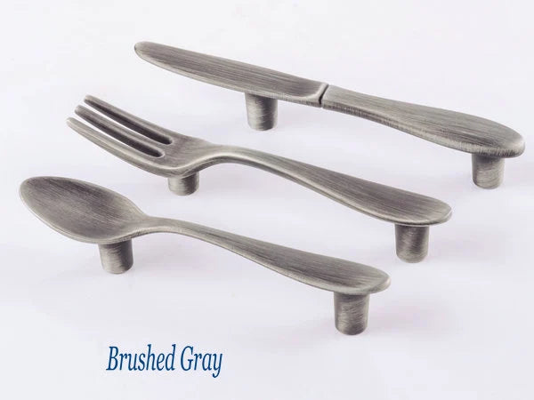 brushed gray cutlery-shaped cabinet handles with 3-inch hole spacing