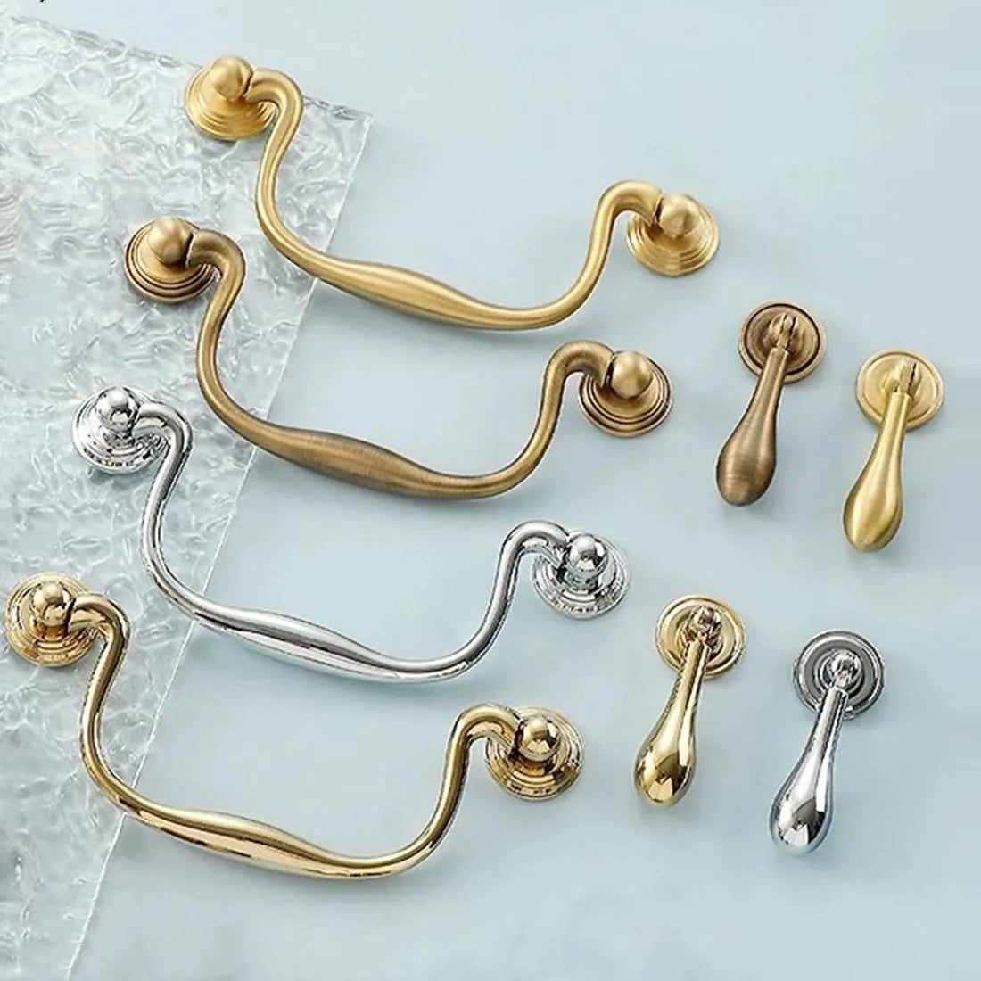 Collection of swan neck swing door handles with matching drop pulls