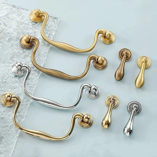 Collection of swan neck swing door handles with matching drop pulls