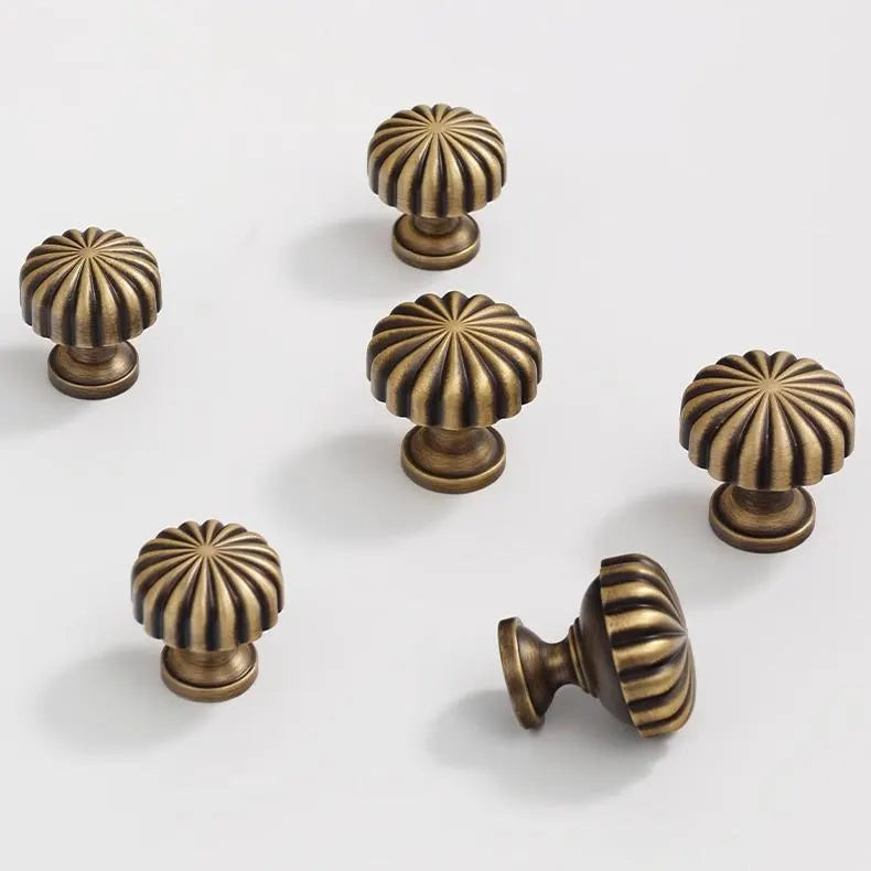 Set of bronze cabinet knobs with sunburst design