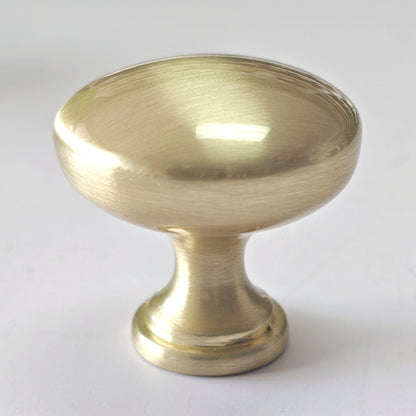 Brass cabinet knob on a white background
