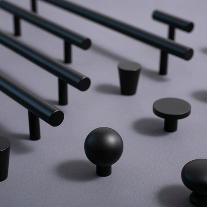 Set of black round drawer knobs and kitchen bar pulls for minimalist home decor 