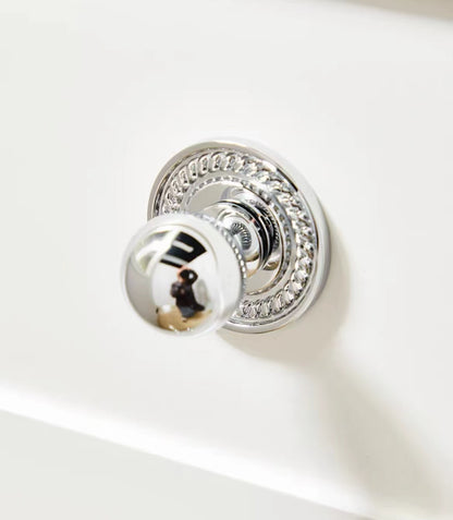 Chrome door knob with decorative round rosette