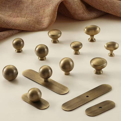  brushed aged bronze round cabinet knobs with oval backplates