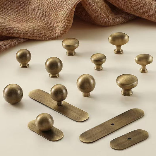  brushed aged bronze round cabinet knobs with oval backplates
