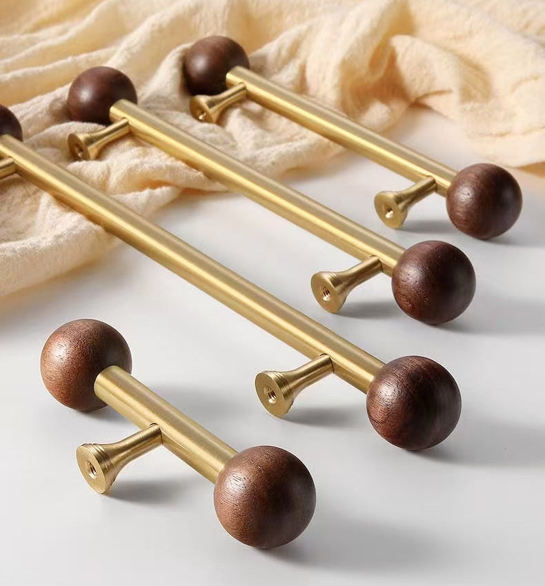 Set of gold and wooden door handles 