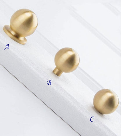 Three gold cabinet ball knobs 