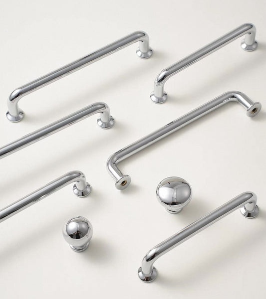 Polished chrome cabinet d pulls and matching round drawer knobs