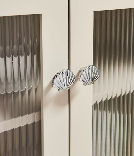 Polished chrome scallop shell drawer knobs for nursery rooms