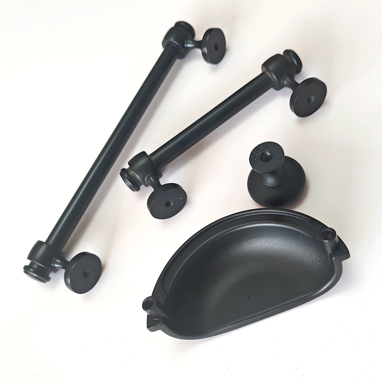 Black metal cabinet handles and pulls on a white background