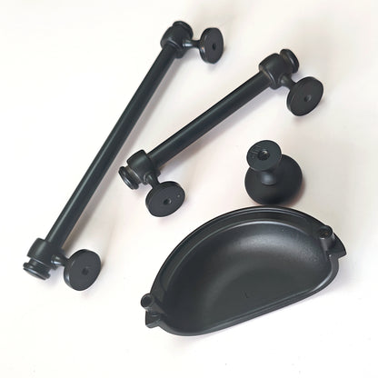 Black metal cabinet handles and pulls on a white background
