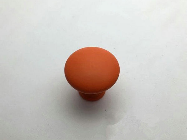 Orange knob on a white background