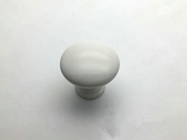 White cabinet knob on a white background
