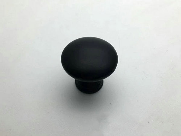 Black cabinet knob on a white background