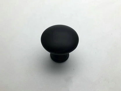 Black cabinet knob on a white background
