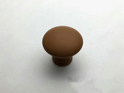 Brown cabinet knob on a white background