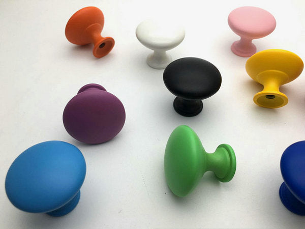 Colorful cabinet knobs on a white background