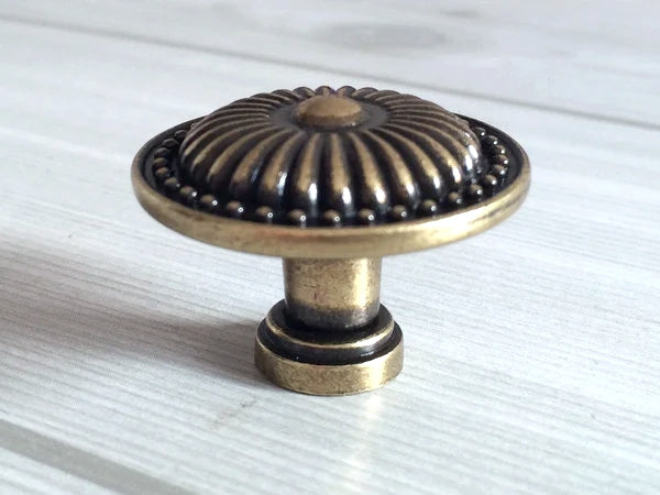 Bronze cabinet knob on a white background