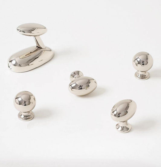 set of polished chrome sphere knobs, oval egg knobs and coat hooks