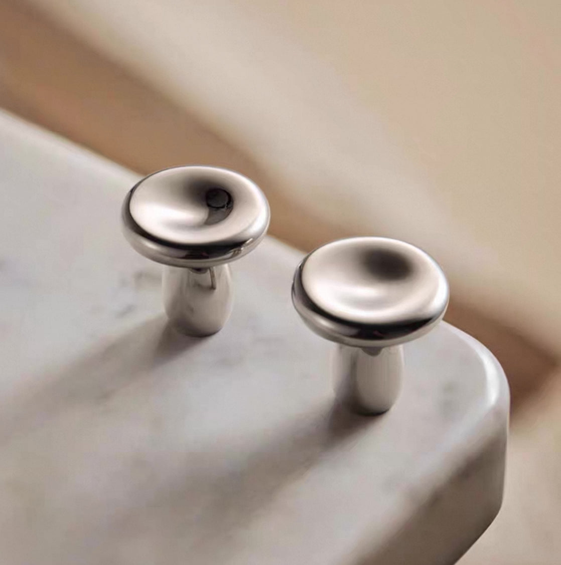 Polished chrome round drawer knobs for modern interiors 