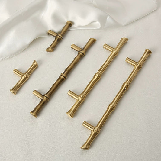 Decorative bamboo drawer handles in antique bronze and polished brass