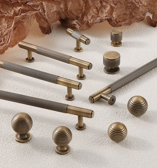 Aged bronze brass reeded cabinet bar handles and matching beehive knobs 