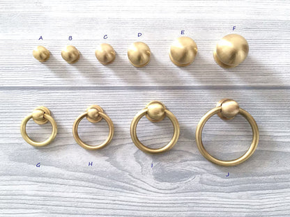 Brushed brass cabinet knobs with ring
