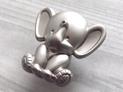 Silver elephant nursery knob on a light gray background