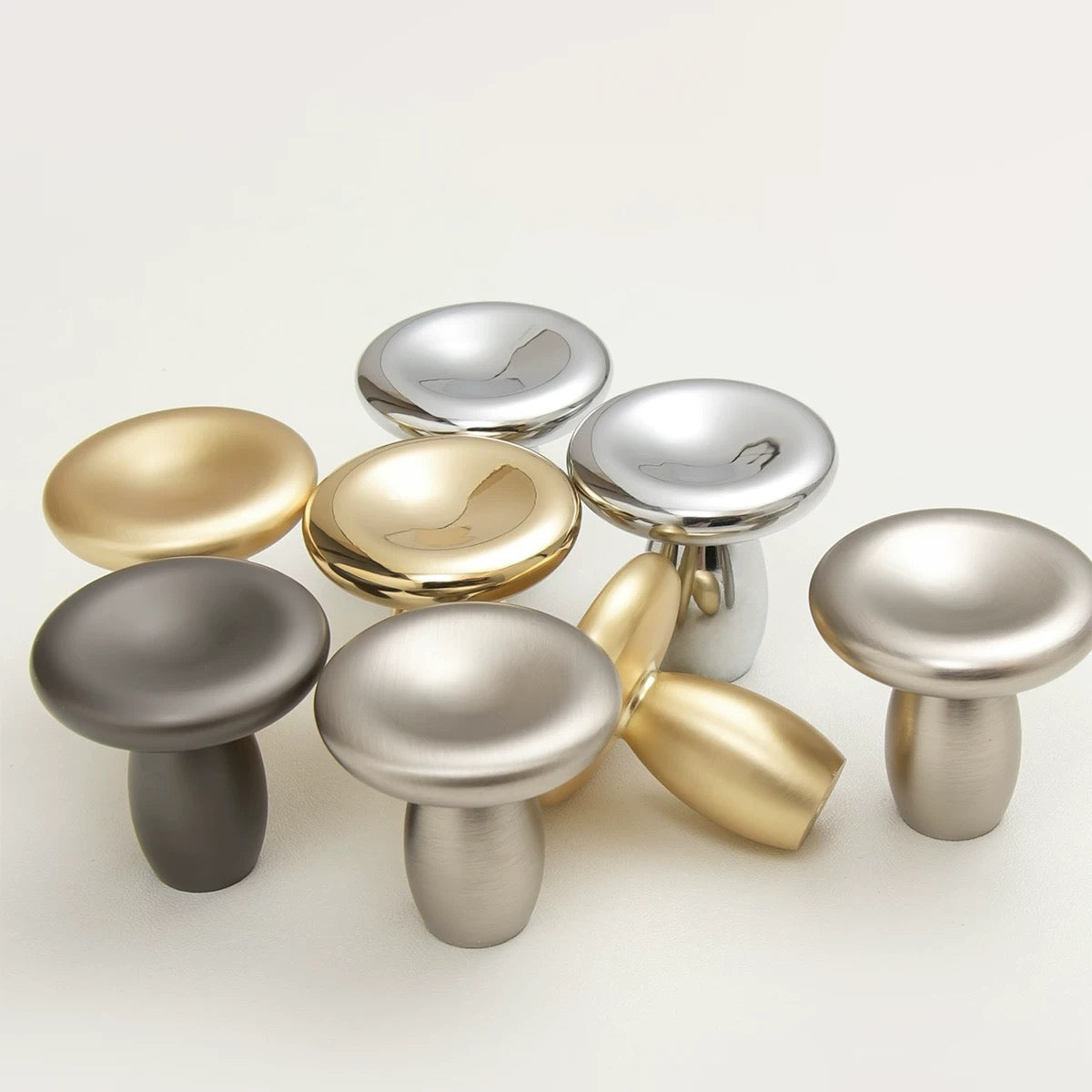 Small round cabinet knobs in chrome, nickel, gold and dark gray