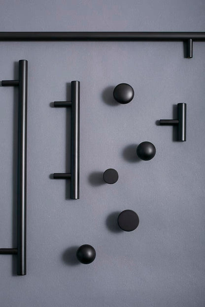 Set of black round drawer knobs and kitchen bar pulls for minimalist home decor 