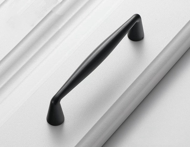 Black handle on a white surface