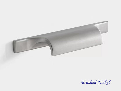 Brushed nickel cabinet finger pull on a white background