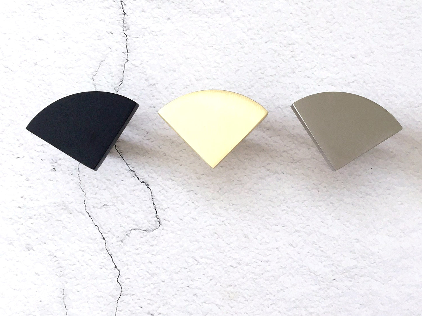 modern quarter moon knobs in black, gold and silver