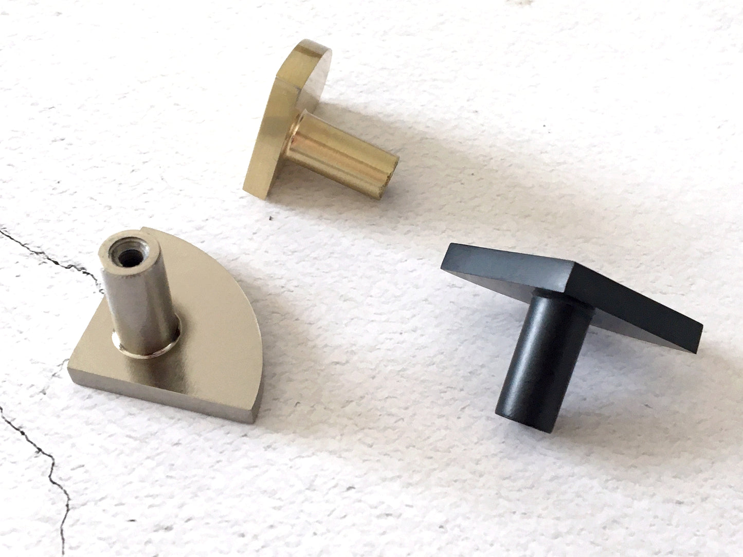 modern sector knobs in black, gold and silver