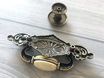 2-1/4" Drop Bail Dresser Pull, Swing Drawer Handle, Ceramic Knob, Ivory Cream Antique Bronze