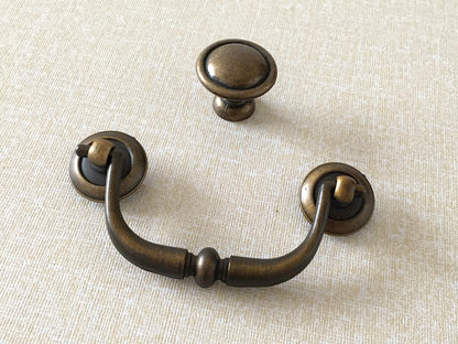 antique gold brass swing bail pull with matching round knob
