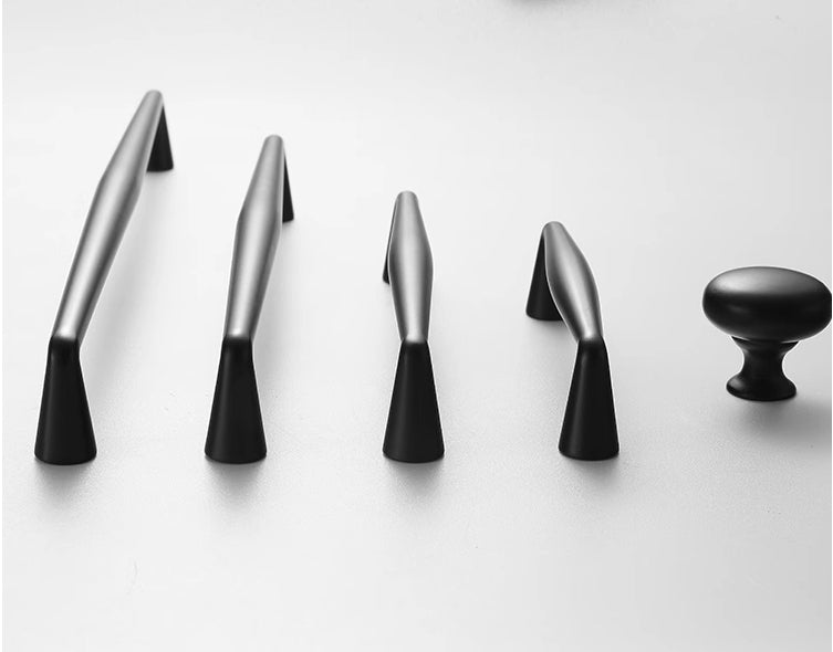 Set of black door handles on a white background