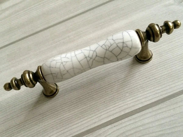 3-inch hole spacing ceramic pull accentuated with antique bronze 