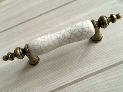 3-inch hole spacing ceramic pull accentuated with antique bronze 