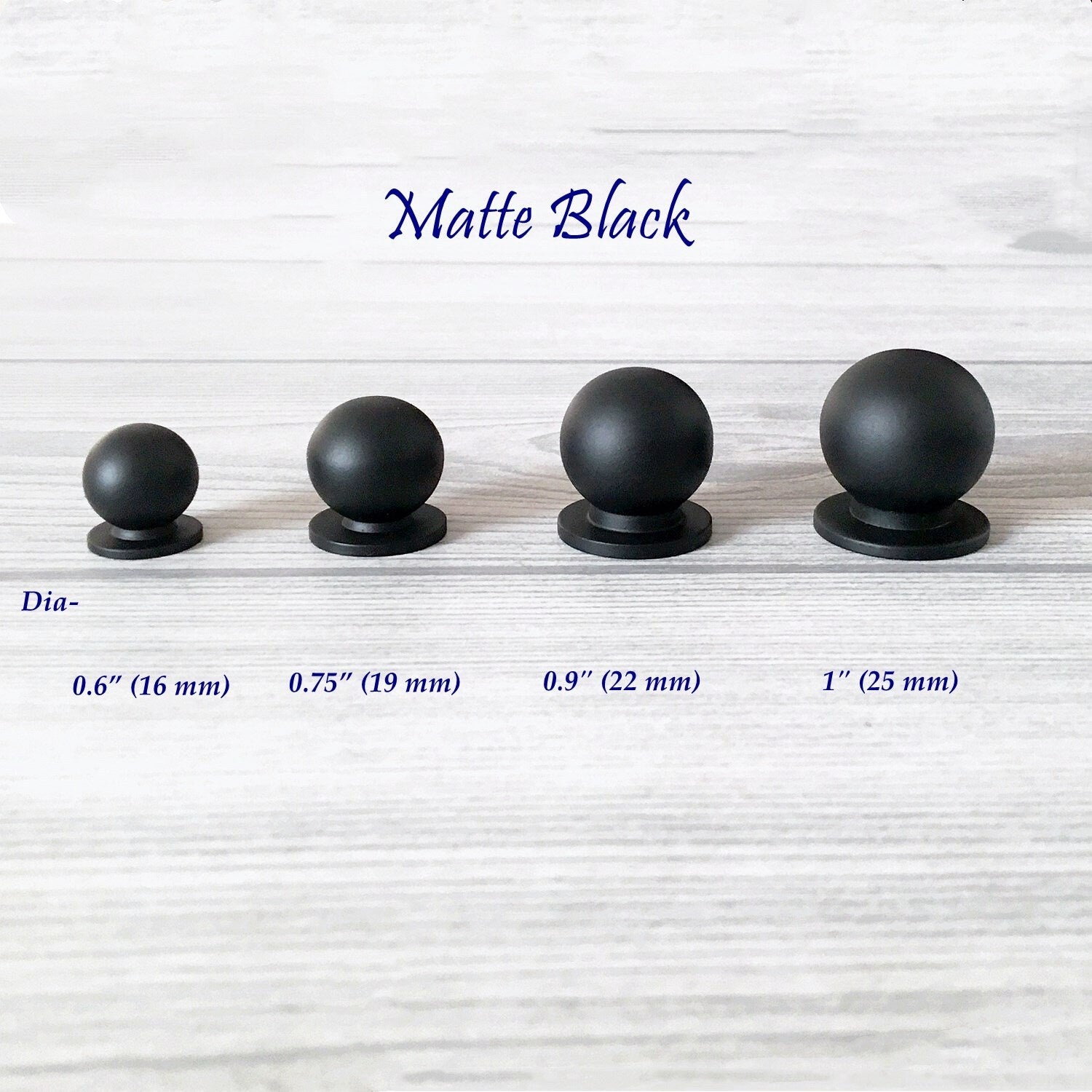 Set of four matte black spherical tiny knobs