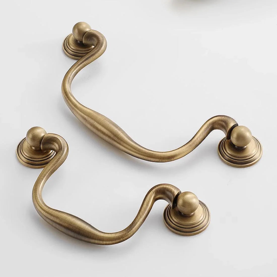 vintage-style antique brass cabinet swing handles with 3 3/4 inch and 5 inch hole spacing