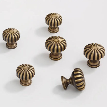 Set of bronze cabinet knobs with sunburst design 