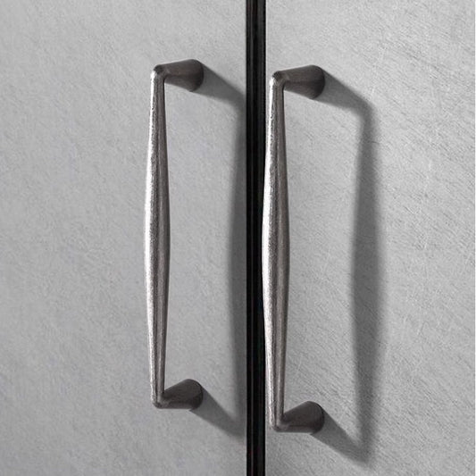 pewter drawer pulls on a cabinet
